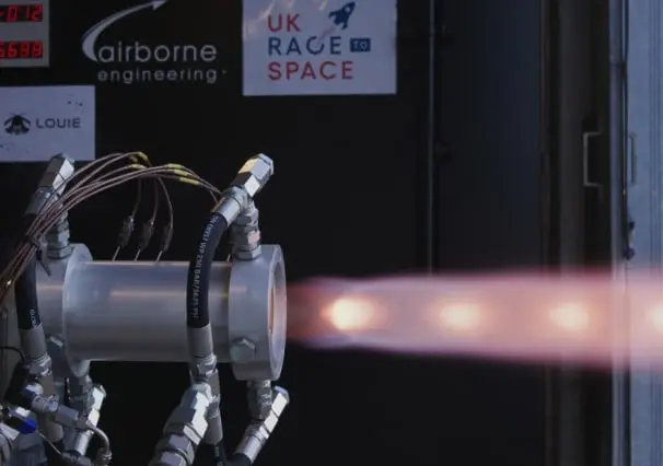 Rocket engine test firing with exhaust flame