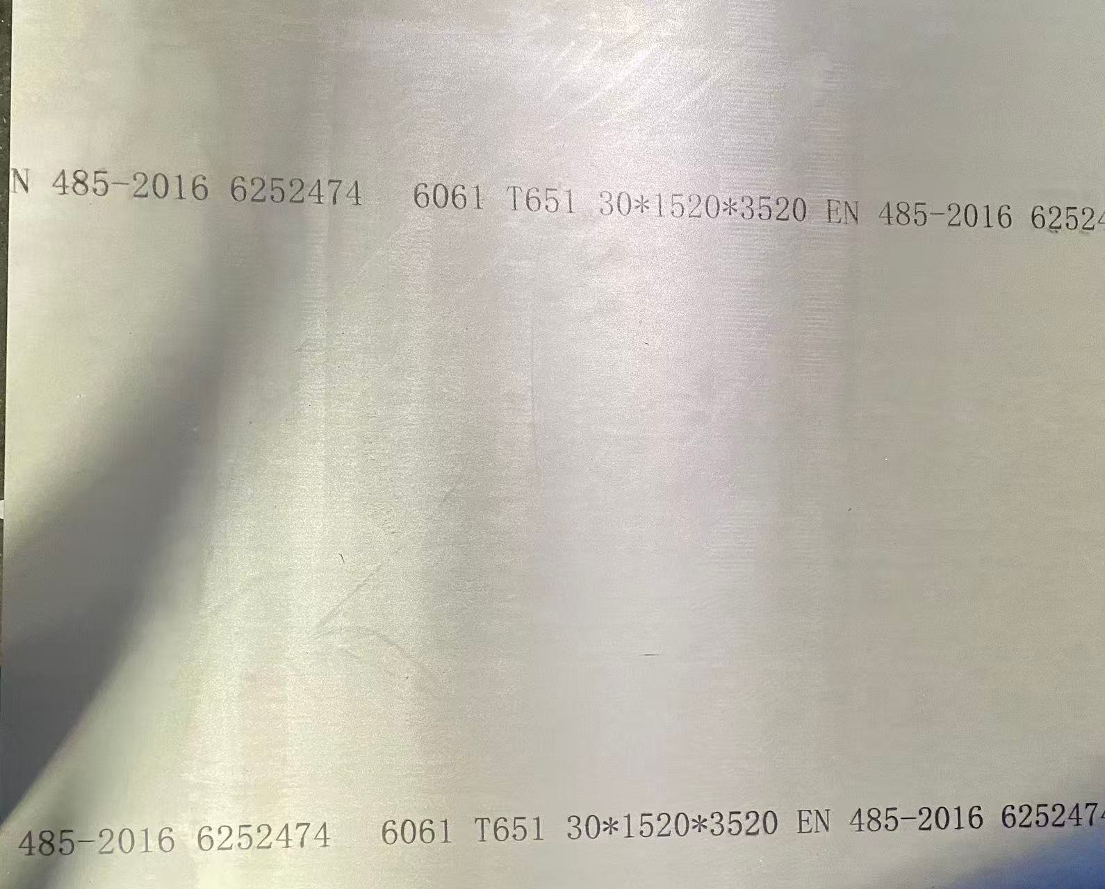 Aluminum sheet with printed technical specifications.