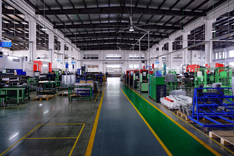 Modern factory with machinery and workstations.